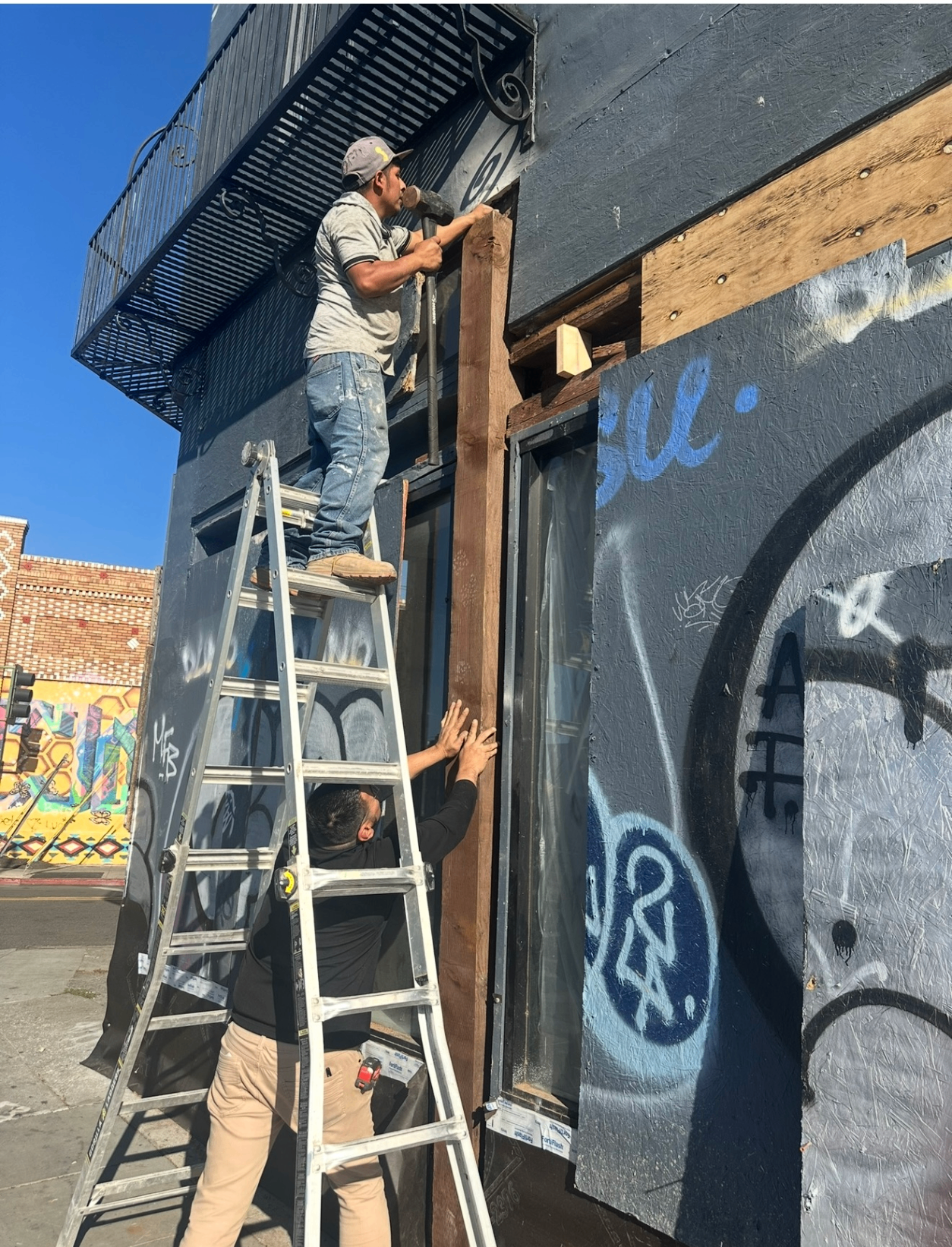 During — Workers rebuilding the exterior